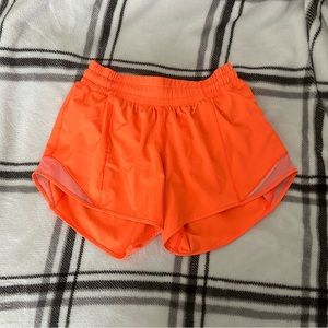lululemon highlight orange hotty hot shorts